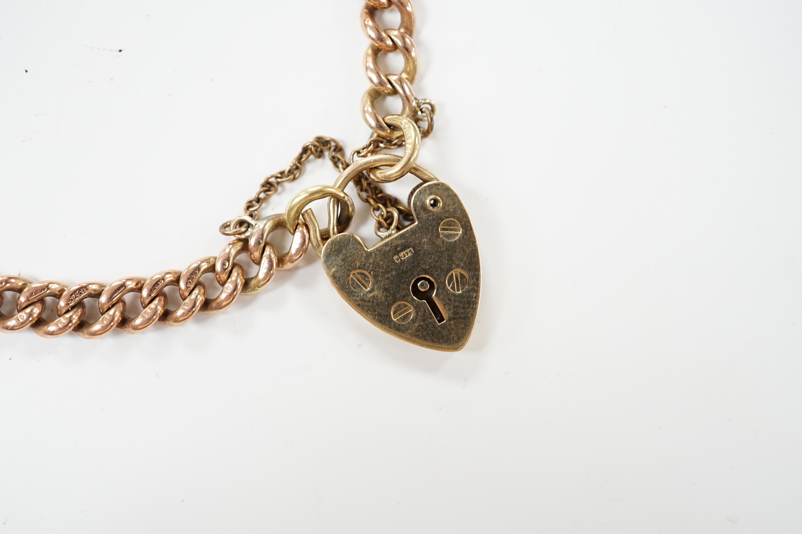 A 9ct gold curb link bracelet, with heart shaped padlock clasp, 18cm, 15.6 grams.